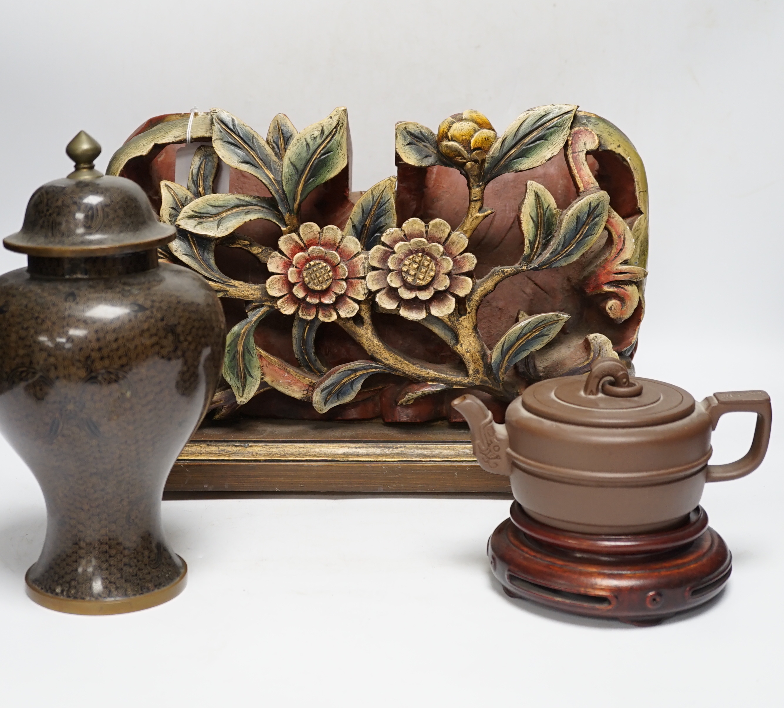 A Chinese floral wooden carving, 40cm wide, together with a Chinese cloisonné enamel vase and cover, 25cm tall, and a Chinese Yixing redware teapot